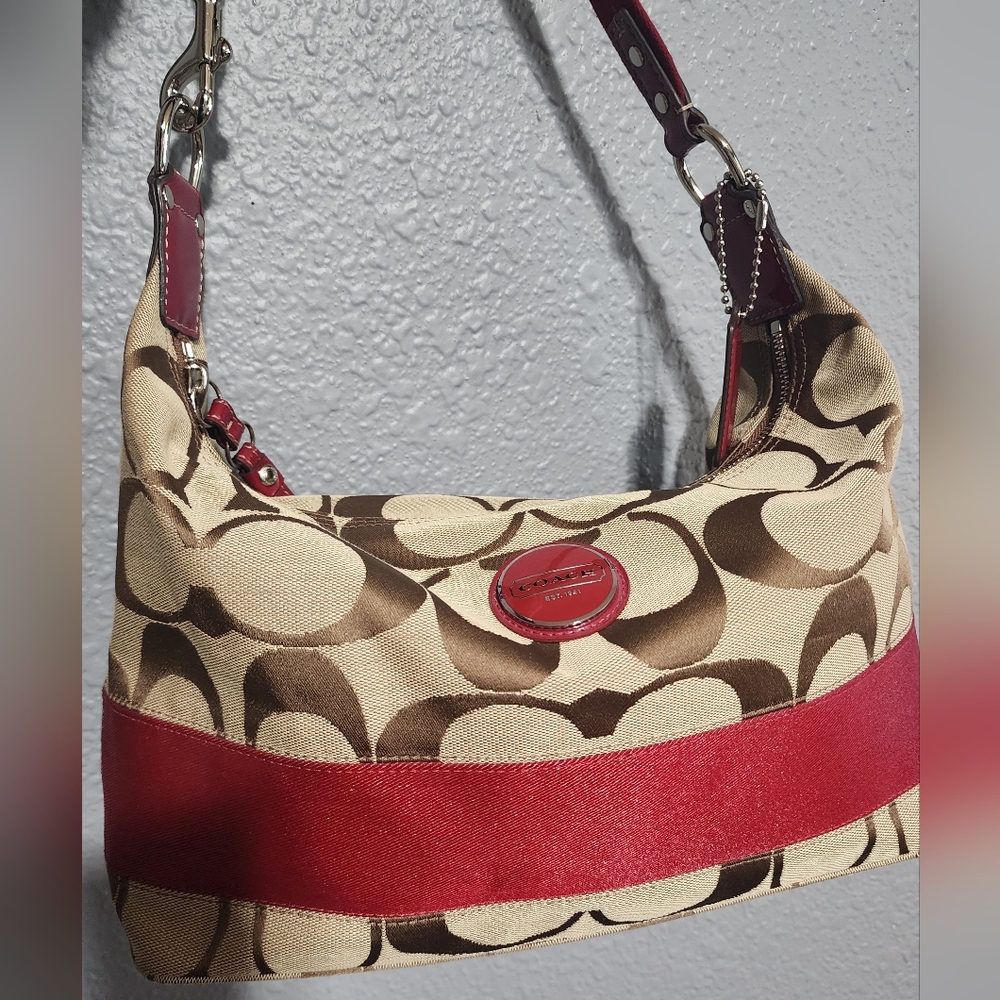 Coach Carly Signature Hobo Bag.